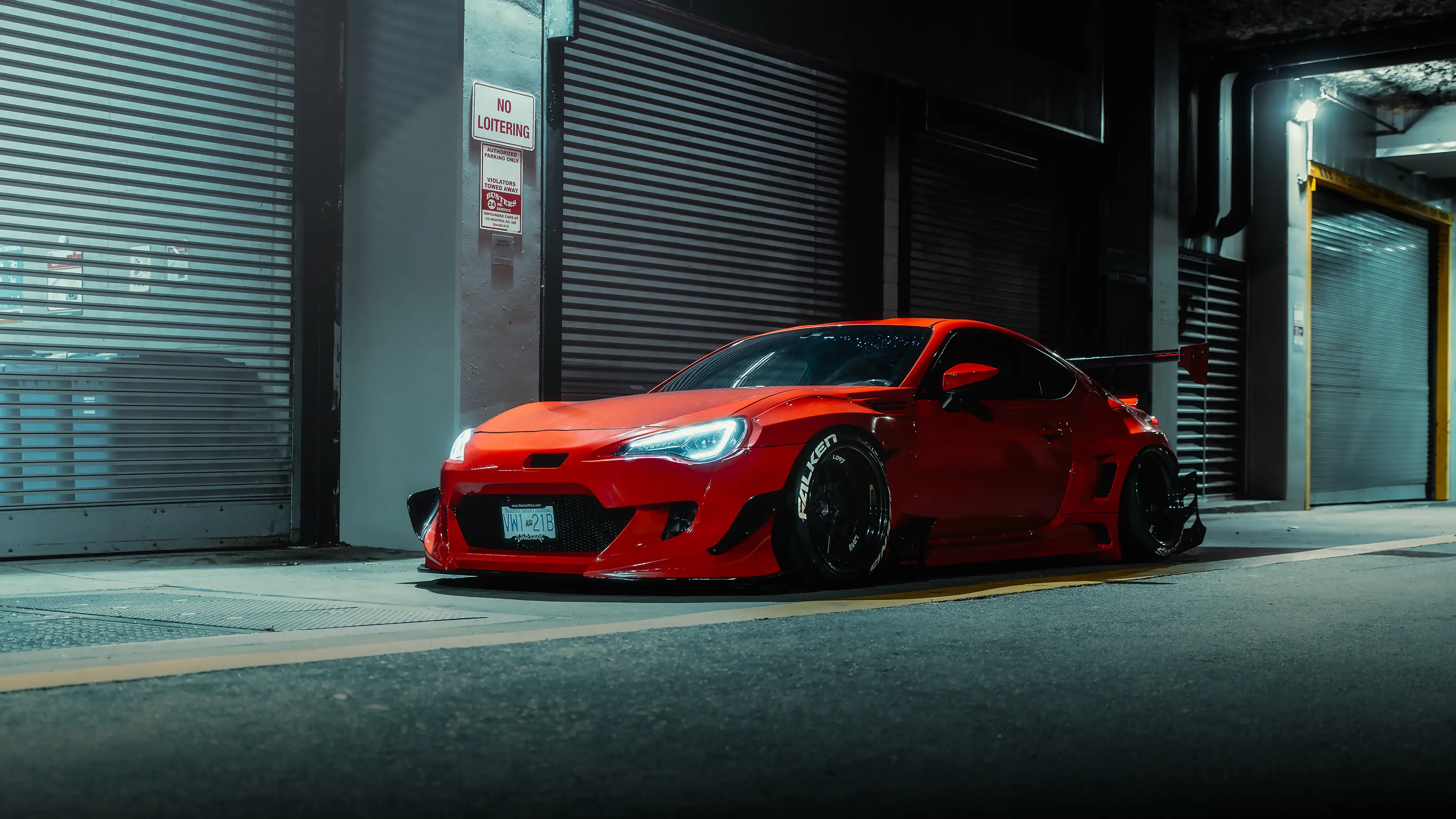 Orange Toyota GT86 front view at night in Vancouver